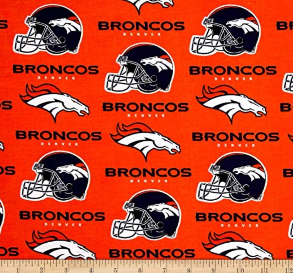 Denver Broncos NFL Logo and Helmet Design on Orange 58" Cotton Fabric